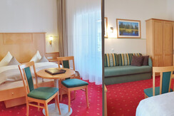 Sample of a triple room with double- and sofa-bed