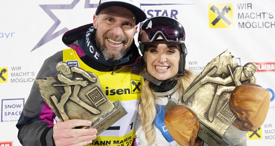 Marco Büchl and Corinna Kamper holding trophies at Starchallenge 2024 Flachau | © Snow Space Salzburg + Wildbild