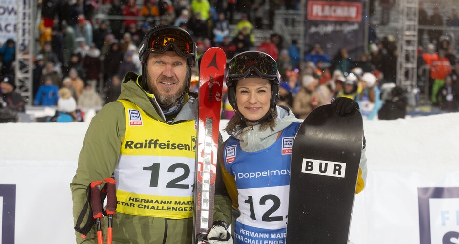 Hermann Maier with skis and Christina Stürmer with snowboard in finish area | © Snow Space Salzburg / Wildbild