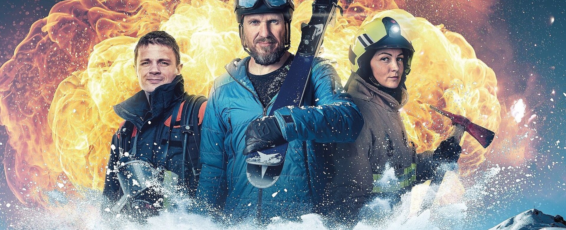 Three people in winter gear with equipment in front of explosion and snowy mountain scenery