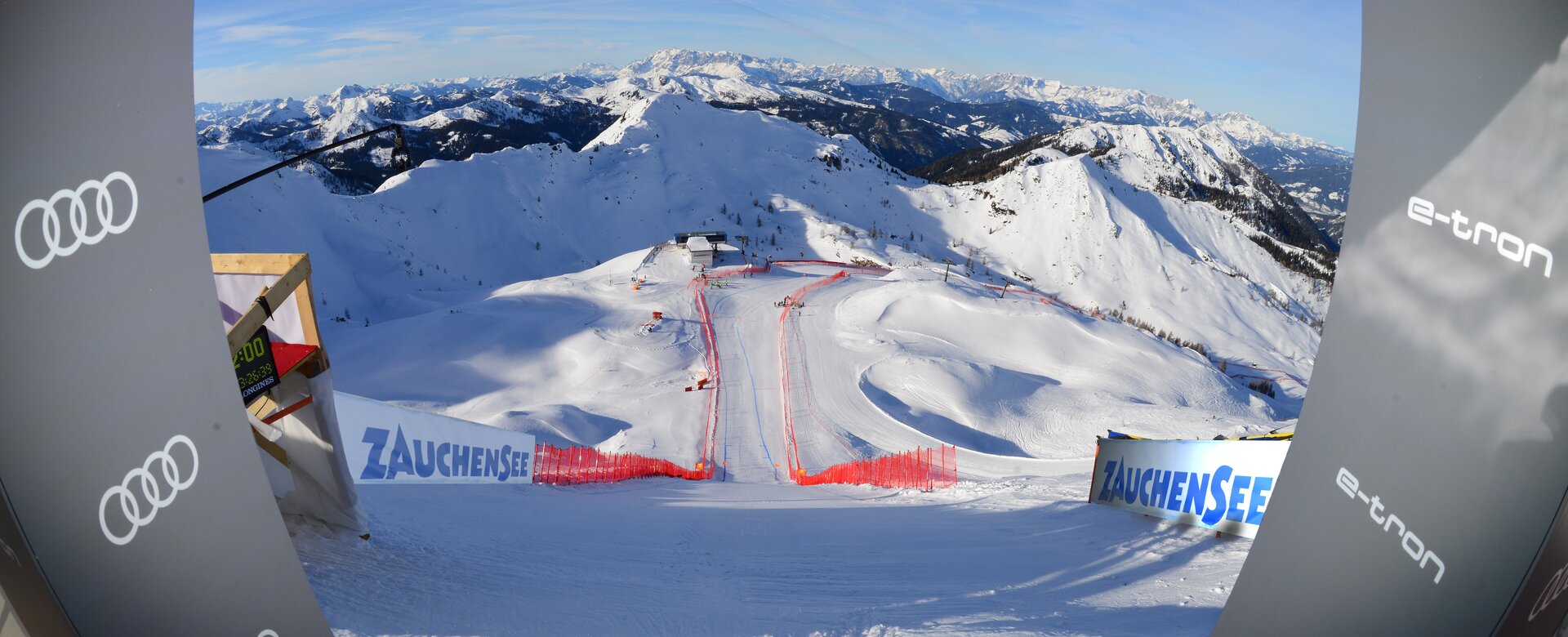 View from the start house of the Ski World Cup women's downhill run, which runs steeply into the snow-covered winter landscape.