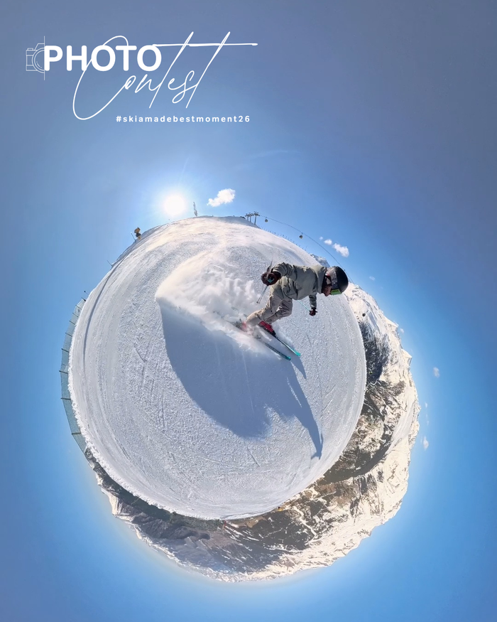 Skifahrer fährt auf verschneiter Piste in 360-Grad-Tiny-Planet-Ansicht mit Bergen und blauem Himmel