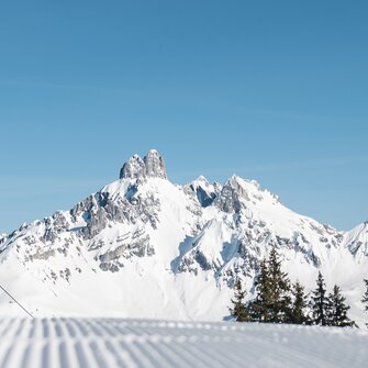 View of the snow-covered Bischofsmütze from the ski piste