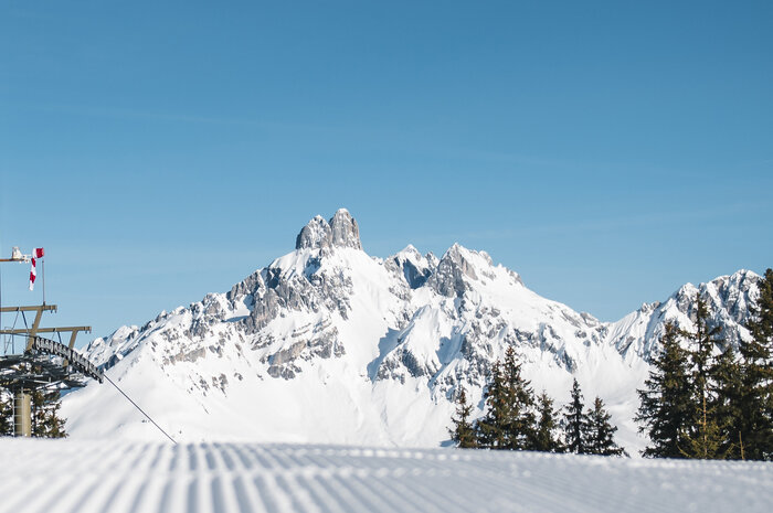 View of the snow-covered Bischofsmütze from the ski piste