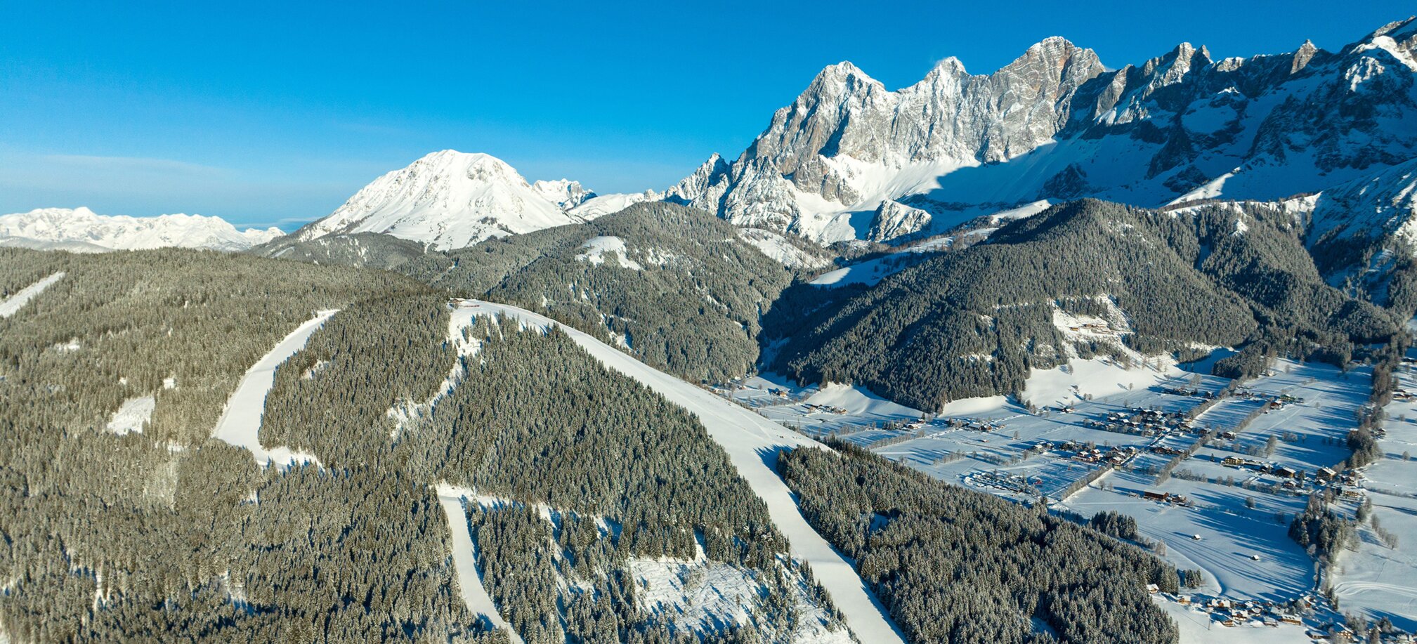 Ski mountain from above in winter and everything is covered in snow