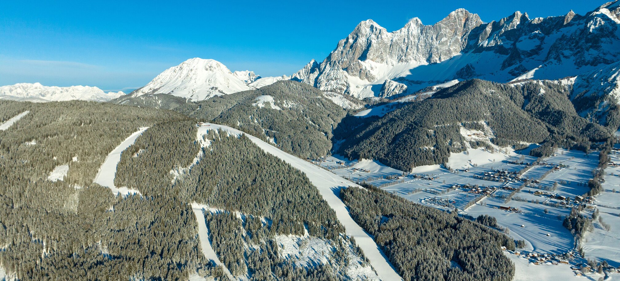 Ski mountain from above in winter and everything is covered in snow