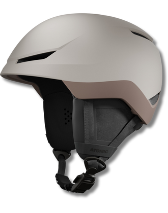 Beigefarbener Atomic Skihelm mit braunen Details, Belüftungsöffnungen und verstellbarem Kinnriemen vor weißem Hintergrund.